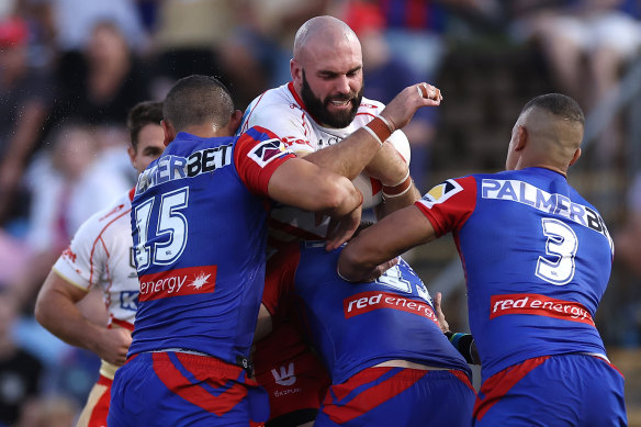 NEWCASTLE, AUSTRALIA - MARCH 17:  Mark Nicholls of the Dolphins is tackled during the round three NRL match between Newcastle Knights and Dolphins at McDonald Jones Stadium on March 17, 2023 in Newcastle, Australia. (Photo by Cameron Spencer/Getty Images)