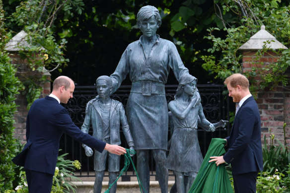 Prince William and Prince Harry take the covers off the statue of their late mother at Kensington Palace in 2021.