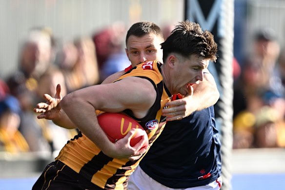 Mitch Lewis is tackled.