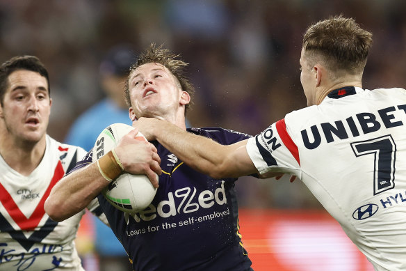 The Roosters weren’t penalised for this late high tackle on Harry Grant.