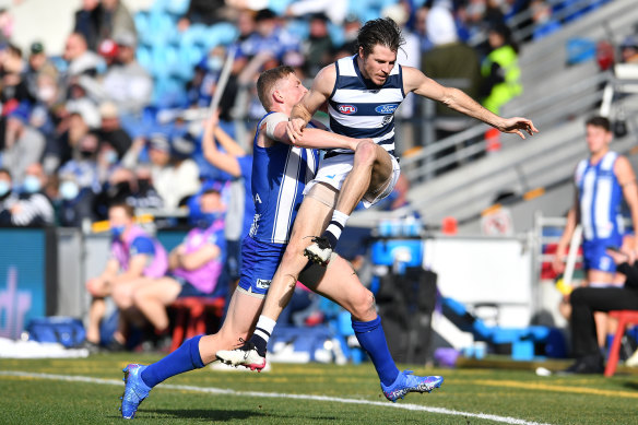 Geelong’s Isaac Smith is tackled by Jack Ziebell.