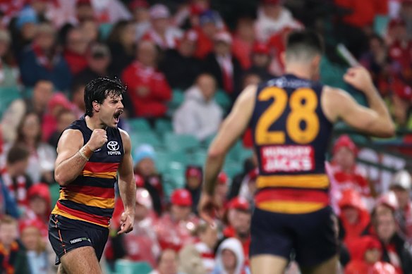 Darcy Fogarty celebrates a goal for the Crows.