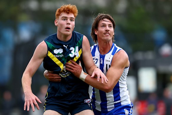 Ethan Herbert (left) and Wil Dawson compete in an AFL national academy match. 