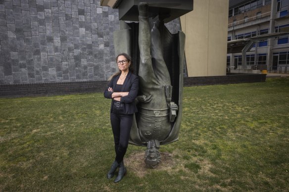 Professor Clare Wright, with the statue Landmark, by Charles Robb, hopes to overturn ideas about public statues.