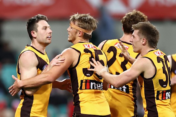 Liam Shiels and the Hawks celebrate a last term goal.