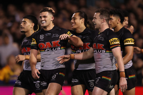 Nathan Cleary and Dylan Edwards celebrate a Panthers try.