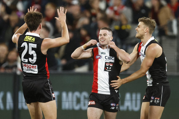 Jack Higgins pops his collar after kicking a goal.