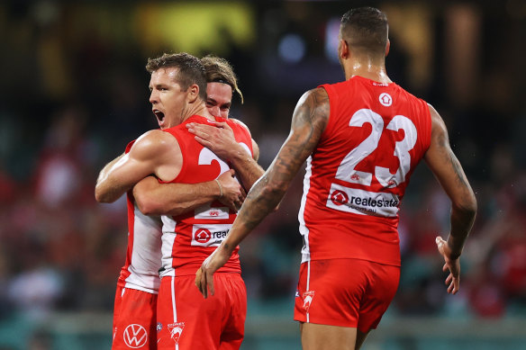 Luke Parker celebrates a goal against Essendon