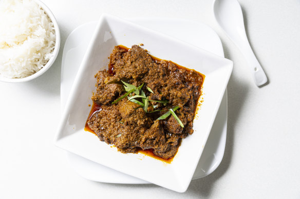 Beef rendang with roasted coconut.