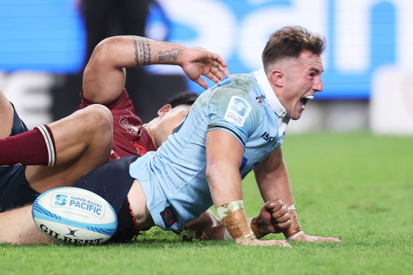 Jack Bowen of the Waratahs celebrates scoring a try at Allianz Stadium.