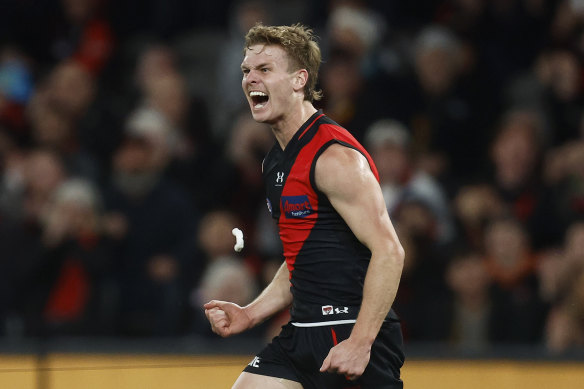Hobbs celebrates a goal against Adelaide.