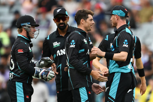 Mitchell Santner celebrates the wicket of Travis Head.