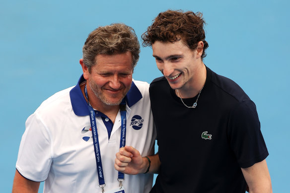 Team France captain Nicolas Copin celebrates with Ugo Humbert after victory over Daniil Medvedev.