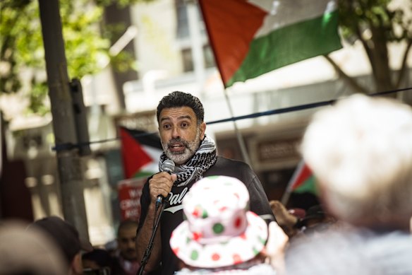 Nasser Mashni, a leader of Australia’s Palestinian movement, speaks outside the State Library on Sunday.