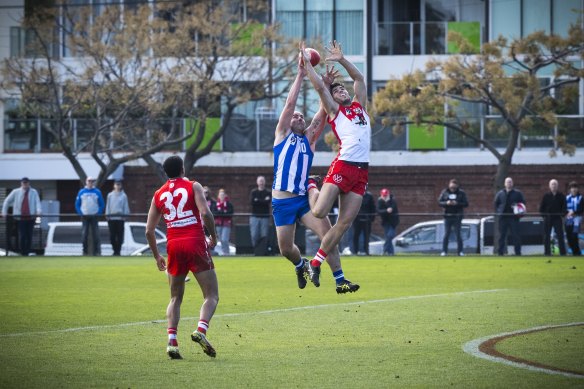 Cunnington in a marking contest against the Swans on Sunday.