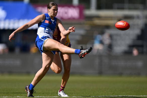 Jasmine Garner gets a kick away for the Kangaroos.