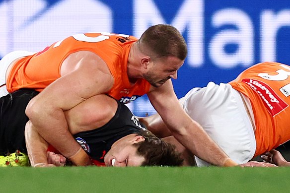Kieren Briggs of the Giants tackles Sam Durham of the Bombers.