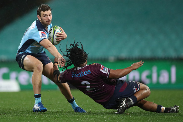 Former Waratah James Ramm steps Reds hooker Brandon Paenga-Amosa in Sydney in August 2020. 