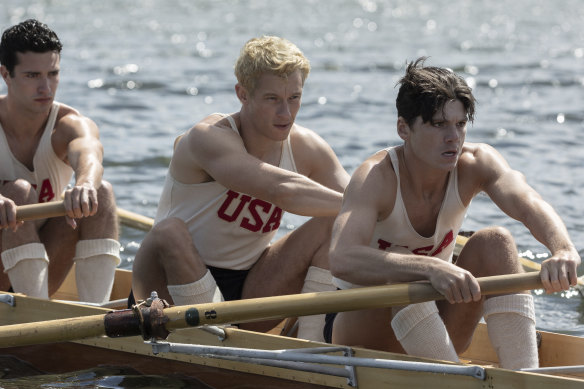 Bruce Herbelin-Earle (from left) Callum Turner and Jack Mulhern row, row, row their boat in The Boys in the Boat.