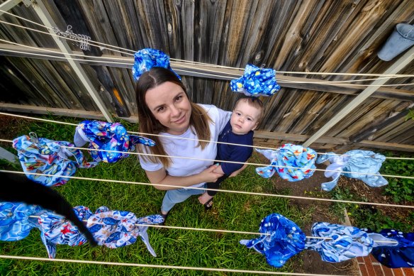 Alana Archer- Veith with her nine-  month-old son, Everett, and her stock of reusable nappies.