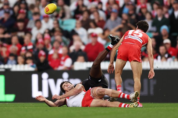 Tom McCartin of the Swans collides with Liam Ryan of the Saints.