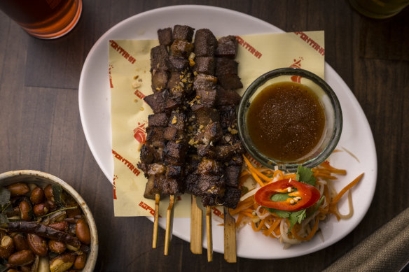 Ox tongue skewers with with crispy garlic.