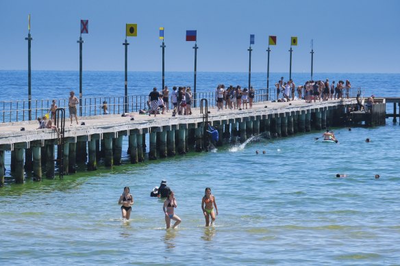 Beachgoers in Frankston soak up the weekend’s hot conditions.