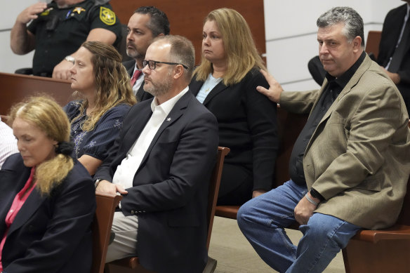 Tony Montalto, seated with his wife, Jennifer, reacts during the reading of jury instructions in the penalty phase of the trial of Marjory Stoneman Douglas High School shooter Nikolas Cruz.
