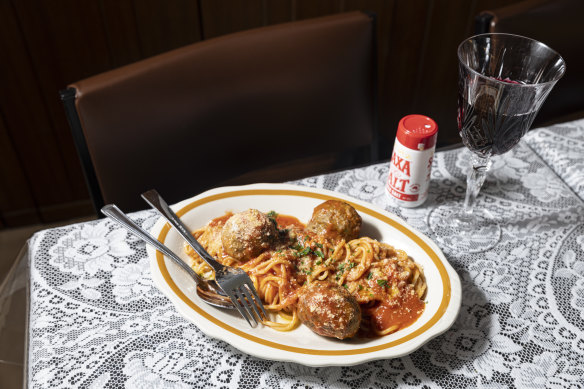 Spaghetti and meatballs at Johnny, Vince and Sam’s, which features tables topped with lace and plastic.