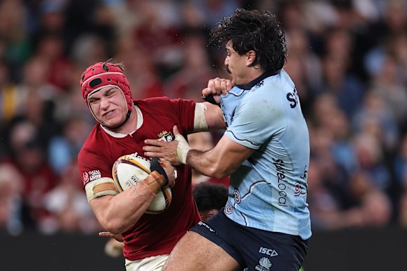 SYDNEY, AUSTRALIA - JULY 05: Josh van der Flier of the British and Irish Lions is tackled during the tour match between NSW Waratahs and British & Irish Lions at Allianz Stadium on July 05, 2025 in Sydney, Australia. (Photo by Cameron Spencer/Getty Images)
