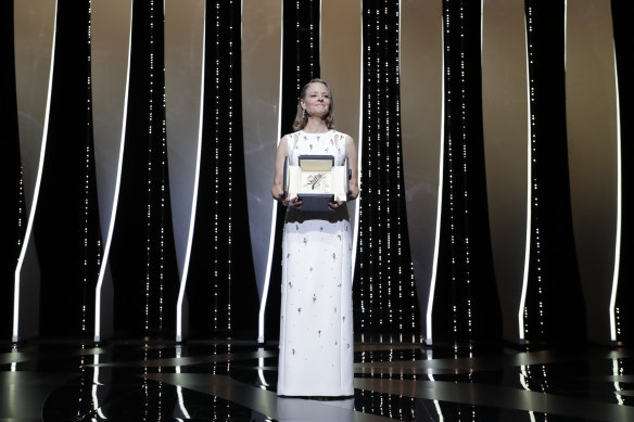 Jodie Foster poses with her honorary Palme d’Or at the opening ceremony of the 74th Cannes Film Festival.