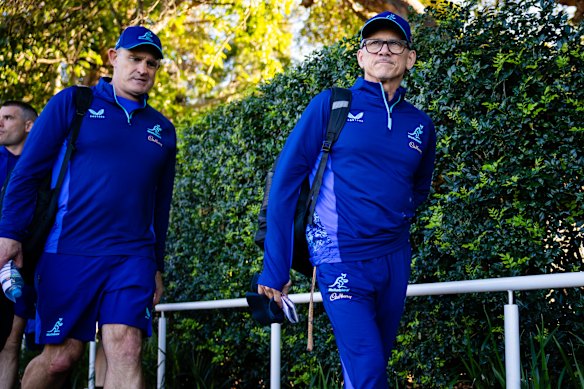 Less Kiss (right) and new defence coach Scott McLeod (left) arrive at Wallabies training.