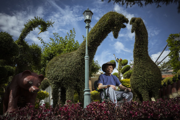 Self-taught topiarist Ick Chu in his Sunshine West front yard.