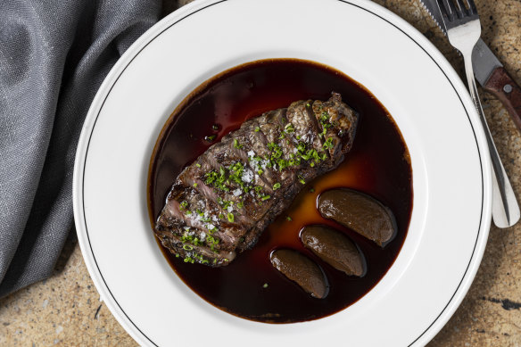 Entrecote steak with quenelles of smoked onion and bordelaise sauce.