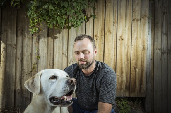 Brunswick resident Robert Lechte, a co-founder of the Merri-bek Pet Registration Justice Committee, with his golden labrador, Astro.