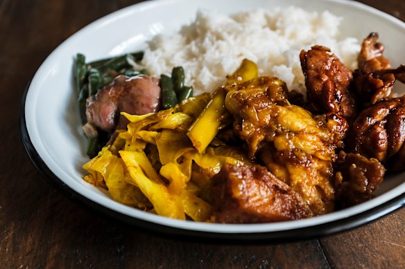 Chomp Chomp’s mixed rice plate with oyster beef, ayam kapitan and braised cabbage.