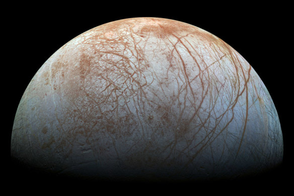Europa has an ocean trapped beneath an icy surface that spews material into space.