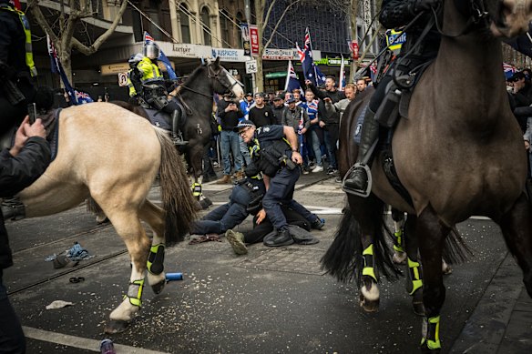 Police tangle with protesters on Sunday.