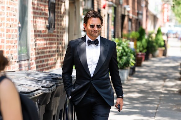 Bradley Cooper suited up in NYC’s West Village on July 3 before Taylor Swift and Travis Kelce’s wedding.