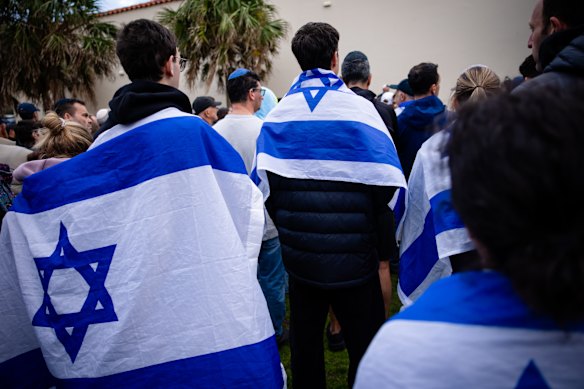 Mourners brought Israeli flags to the vigil. 