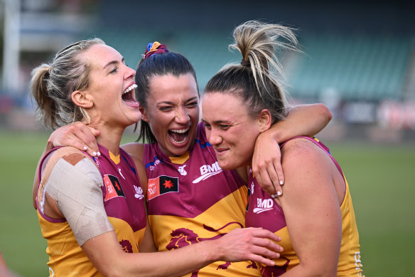 Ellie Hampson, Jade Ellenger and Orla O’Dwyer celebrate a Lions win.