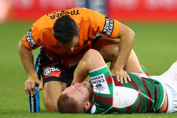 Rabbitoh Thomas Burgess is hurt late in the second half.