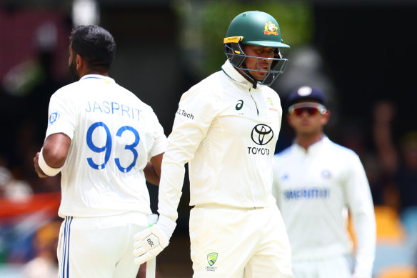 Usman Khawaja walks from the Gabba after being bowled by Jasprit Bumrah.
