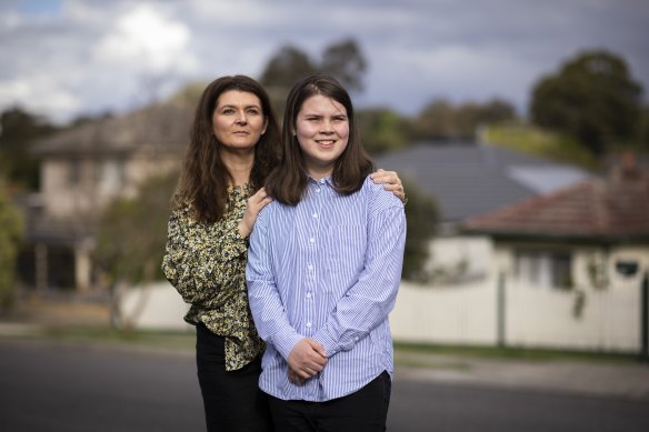 Kylie Kerr with her 13-year-old daughter Lucy at home in Greensborough. On Monday, 12-15 year old children will be eligible for COVID-19 vaccination.