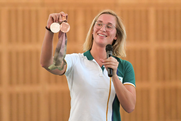 Maddie Groves displays her Olympic medals to students in 2019.