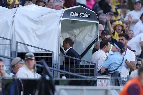 Roar coach Michael Valkanis walks up the tunnel after receiving a second yellow card in Gosford on New Year’s Eve.