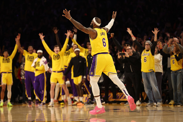 LeBron James reacts after hitting the shot that made him the NBA’s leading scorer.