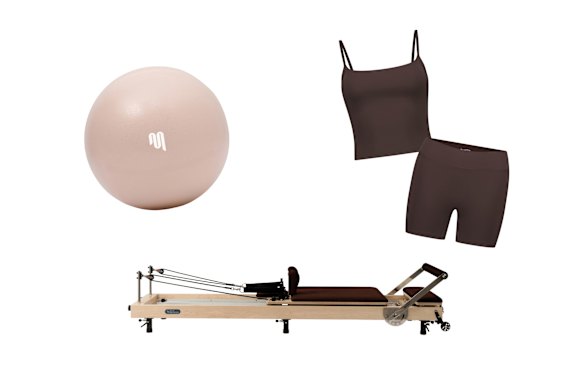 Pilates ball; “YR Original” Pilates reformer; “Cloudcore” tank and bike shorts.  