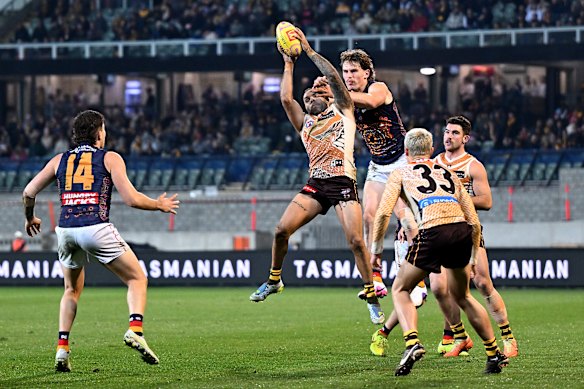 Jarman Impey of the Hawks takes a mark.