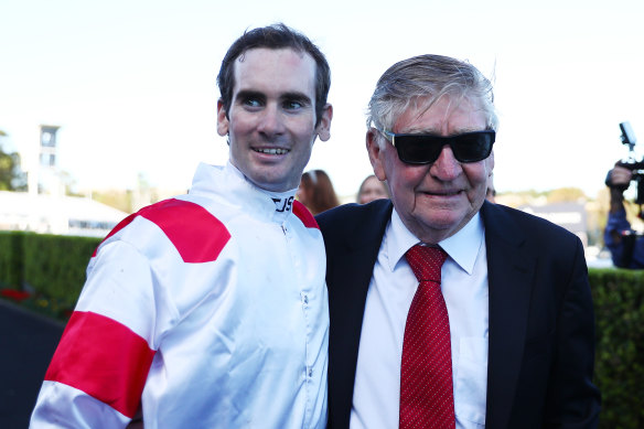 Trainer Les Bridge celebrates with Tyler Schiller.